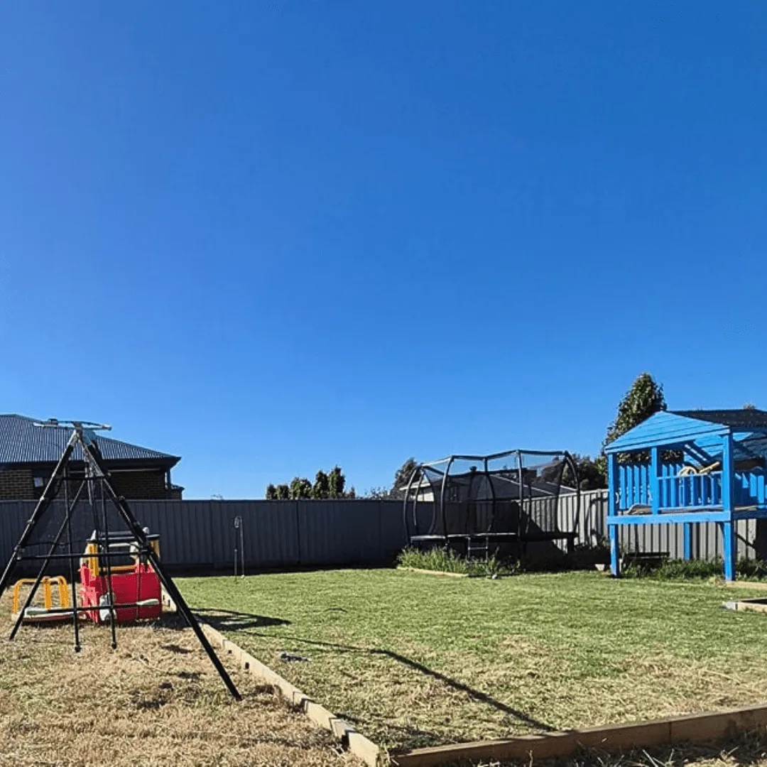 Professional lawn mowing service in Bendigo using commercial ride-on mower on residential property